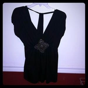 black top with center rhinestone broach